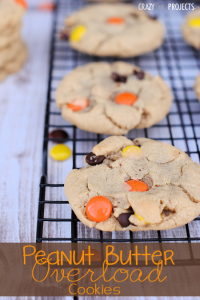 The softest, chewiest Peanut Butter Cookies with Reese's Pieces and Chocolate Chips baked right inside! 