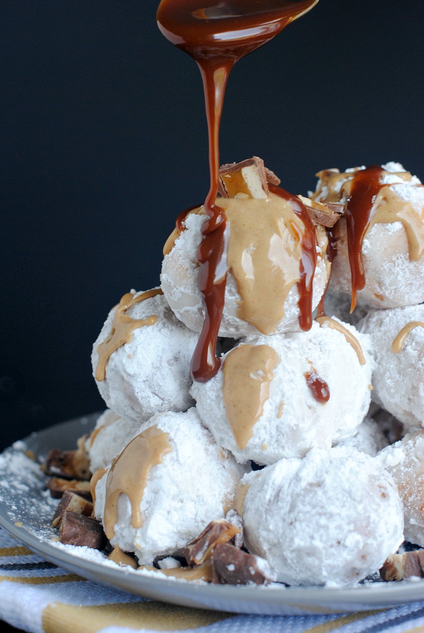 Donut Hole Delight-This amazing donut hole recipe allows you to make your own donut holes and then pile them up and drizzle with yummy sauces like chocolate and peanut butter. #donuts #dessert #dessertrecipe #chocolate #chocolatepeanutbutter