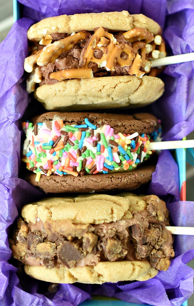 Ice Cream Cookie Sandwich on a Stick! This is a fun summer dessert. Mix and match your cookie flavors, your ice cream flavors and then roll it in a fun topping and put it on a stick and you've got such a fun treat! #summer #dessert #icecream #dessertrecipes #cookies