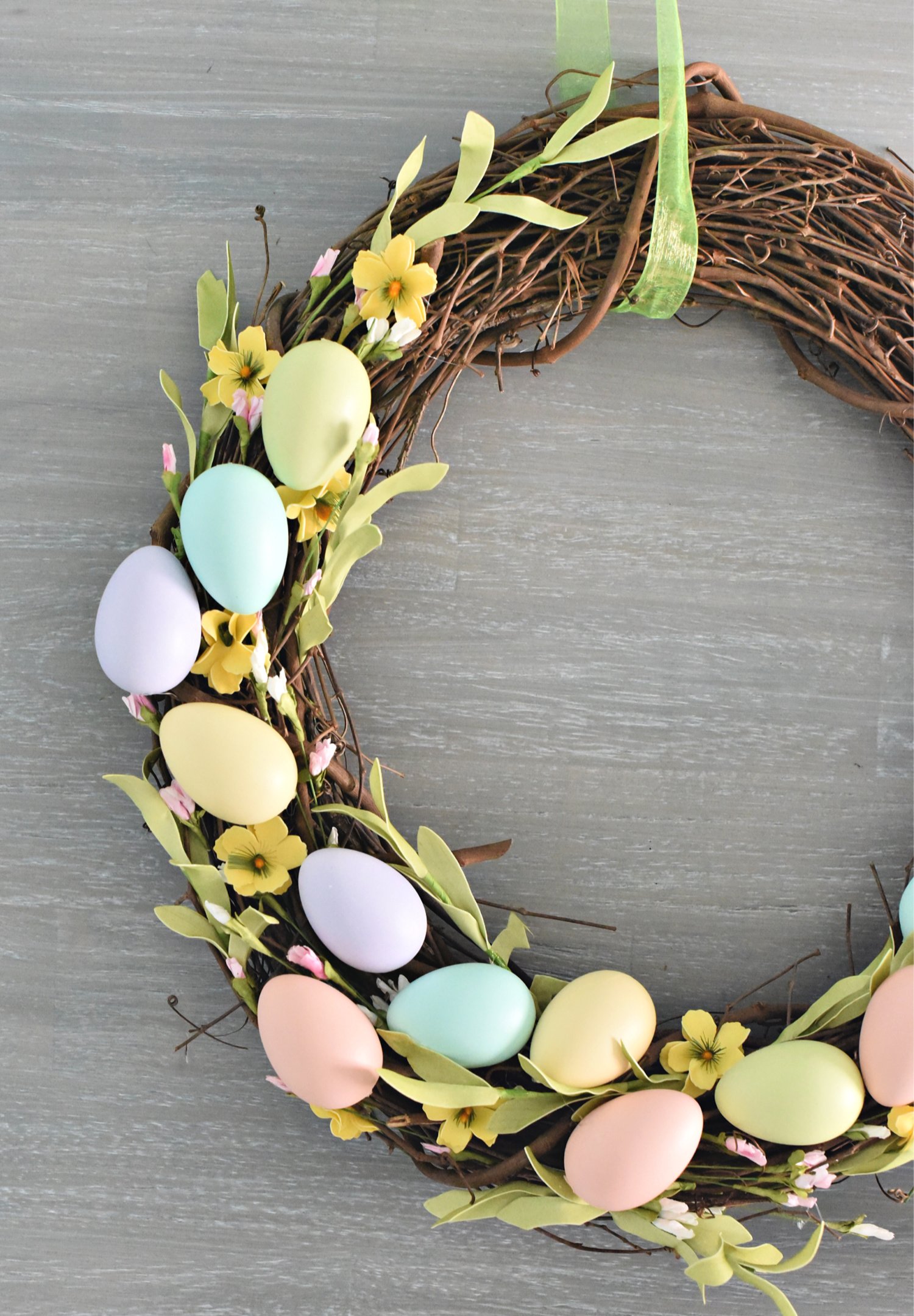 Easter Wreath-This festive Spring wreath is perfect to hang on your door this Spring and it's easy to make! #easter #spring #easterdecor #easterdecorations