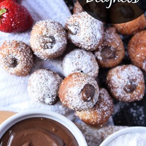 These easy to make Nutella filled French beignets will make you feel like you're in a Parisian cafe. You're going to love how easy this beignet recipe is to make! #beignets #dessert #brunch